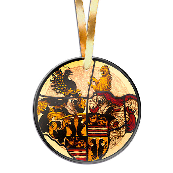 A round stained glass ornament with a heraldic design, featuring coats of arms, crests, and a mantling, set against a damasked field.