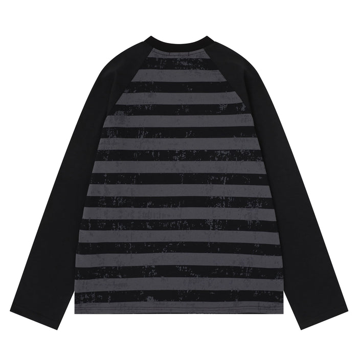 Back view of black raglan long sleeve tee with gray striped body and black sleeves