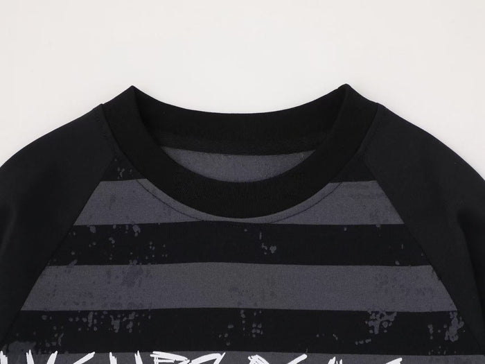 Close-up of black tee collar and upper gray stripes with faded distressed print