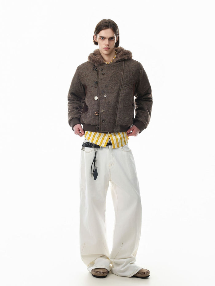 Full-length model view of a brown hooded bomber jacket with faux fur trim and button front