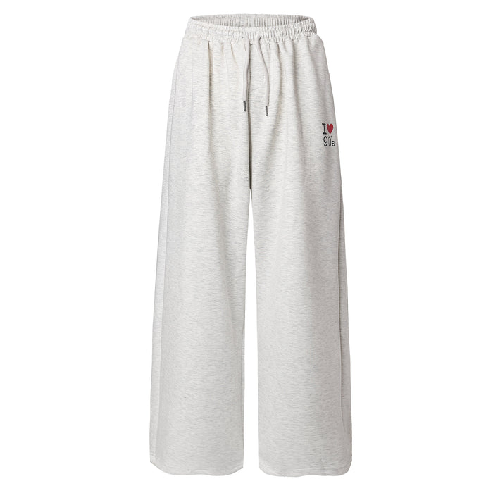 Light gray wide-leg sweatpants with elastic waistband and I heart 90s embroidery