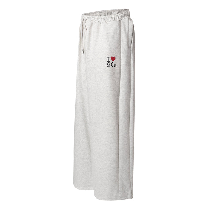 Light gray sweatpants side view with I heart 90s embroidery on the hip