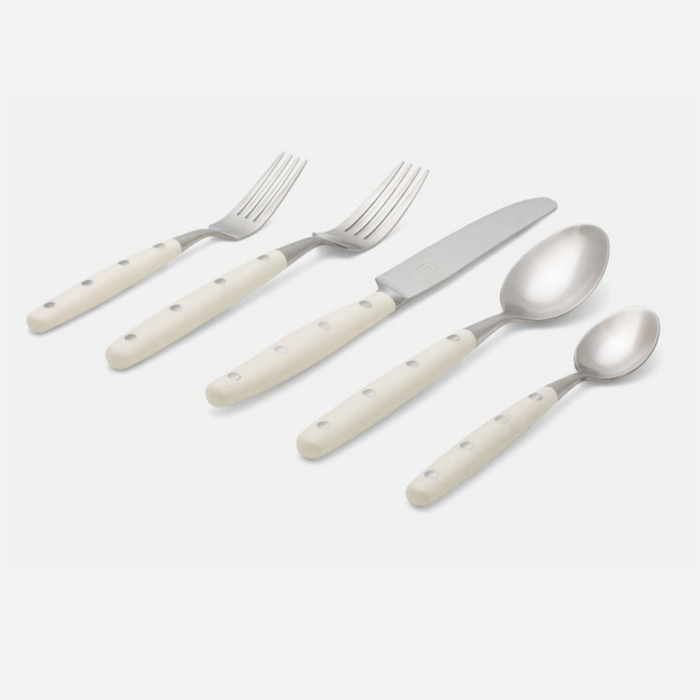The Jones Flatware Ivory by Blue Pheasant is a five-piece stainless steel set—two forks, knife, tablespoon, and teaspoon—with ivory handles and three rivets. Stylish, dishwasher safe flatware for modern dining.