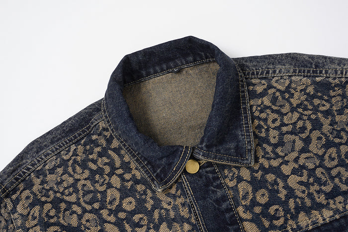 Close-up of the leopard-print denim jacket’s spread collar, top button, contrast stitching, and textured inner collar