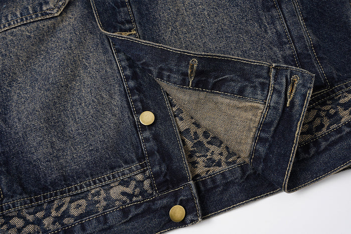 Lower front detail showing the dark denim side pocket opening, leopard-print lining, hem, and brass snap button