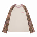 Cream raglan long sleeve tee with pink ribbed collar and leopard print sleeves, front view