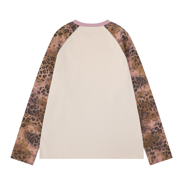 Back view of cream raglan long sleeve tee with pink collar and leopard print sleeves