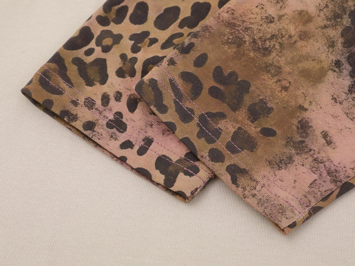 Leopard print sleeve cuff with pink stitching detail