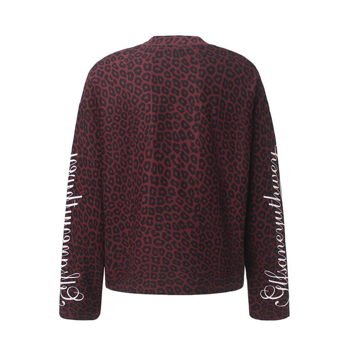 Back view of a burgundy and black leopard-print long-sleeve shirt with white script on both sleeves