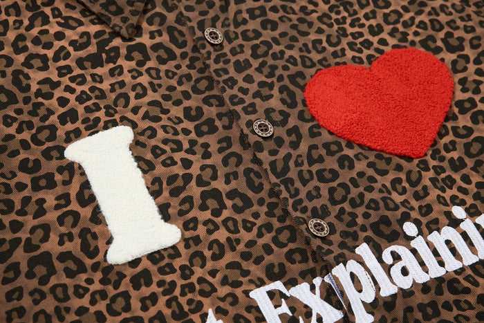 Leopard print shirt with textured I heart graphic, red heart patch, and bold white lettering on button front