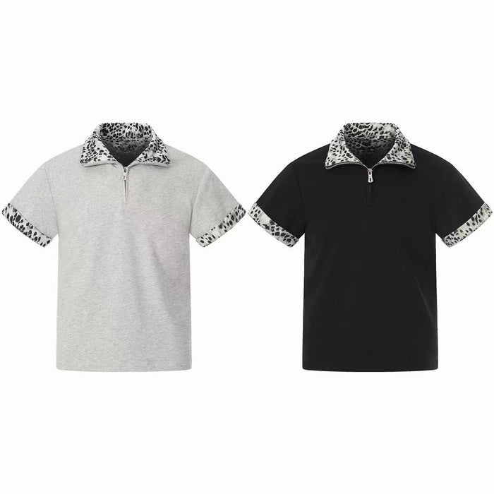 Black short-sleeve quarter-zip polo shirt with leopard print collar and sleeve trim on white background