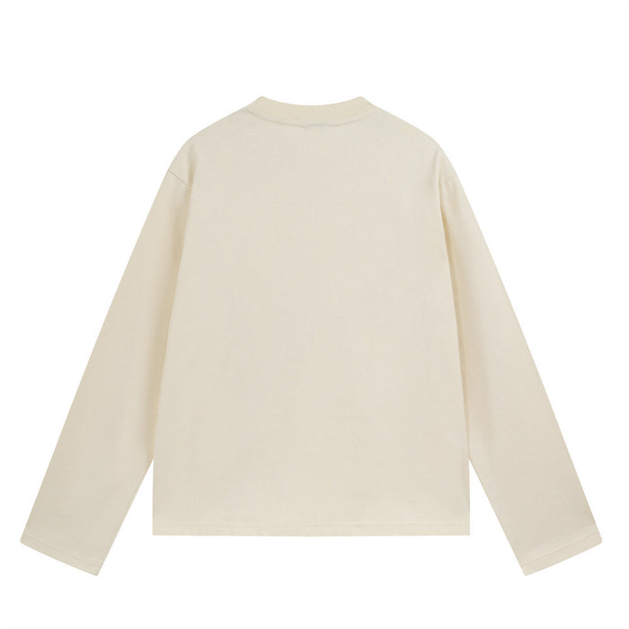 Cream long sleeve crewneck shirt shown from the back with a plain design