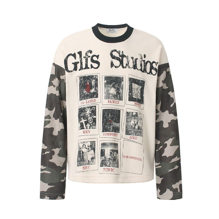Front view of a cream waffle-knit shirt with black Glfs Studios lettering, graphic panels, and camo sleeves