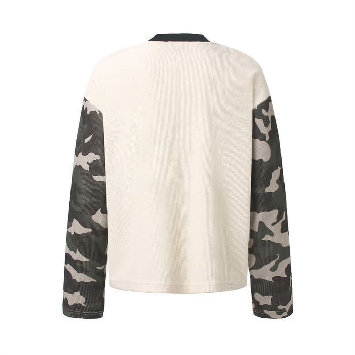 Back view of the cream waffle-knit shirt showing a plain body, black collar, and camouflage sleeves