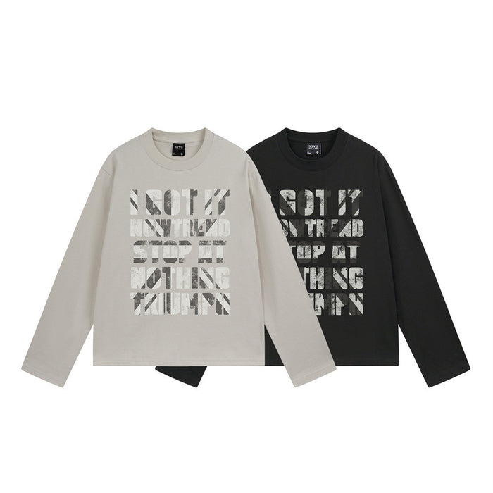 Overlapping light beige and black long-sleeve T-shirts showing matching distressed front lettering