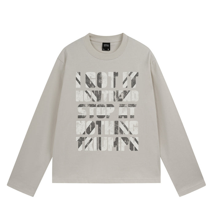 Front view of a light beige long-sleeve T-shirt with distressed stacked letter print