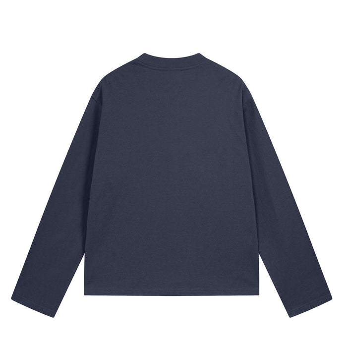Back view of a navy long sleeve crewneck tee with a plain design and relaxed fit