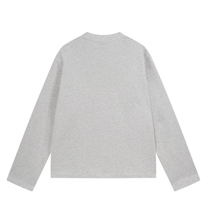 Back view of a heather gray long sleeve crewneck tee with a plain design and relaxed fit