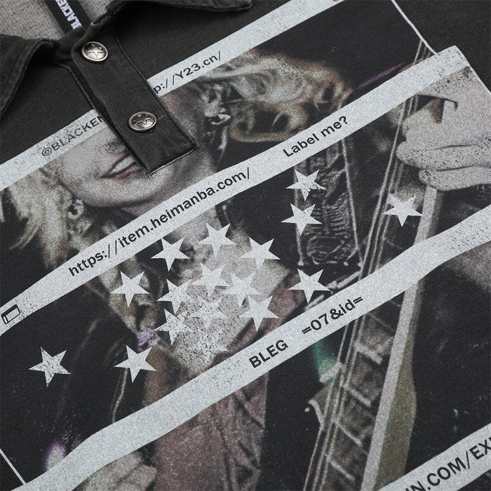 Close-up of graphic print with stars, text strips, and guitar illustration on black shirt