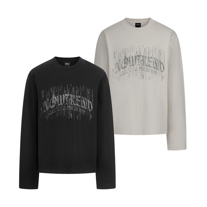 Black and off-white long sleeve tees with distressed gothic letter prints shown together from the front