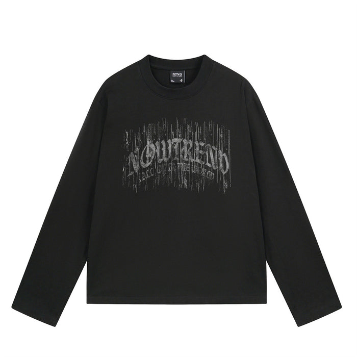 Black long sleeve tee shown front-facing with a distressed gray gothic letter graphic across the chest