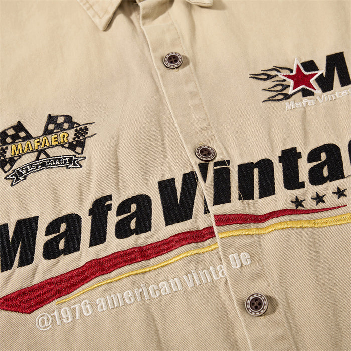 Tight front close-up of Mafa Vintage embroidery and red yellow stripe details