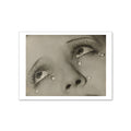 A magnet featuring a reproduction of Man Ray's photograph 'Larmes (Tears)', depicting a close-up of a woman's face with mascara-encrusted lashes and glass beads representing tears.