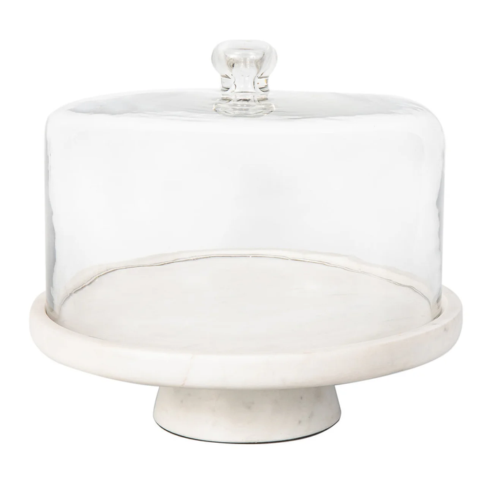 The Godinger Marble Footed Cake Stand with Dome features a round white marble base and pedestal, topped with a clear glass lid with knob handle. Ideal for elegant dessert displays, the stand is shown empty.