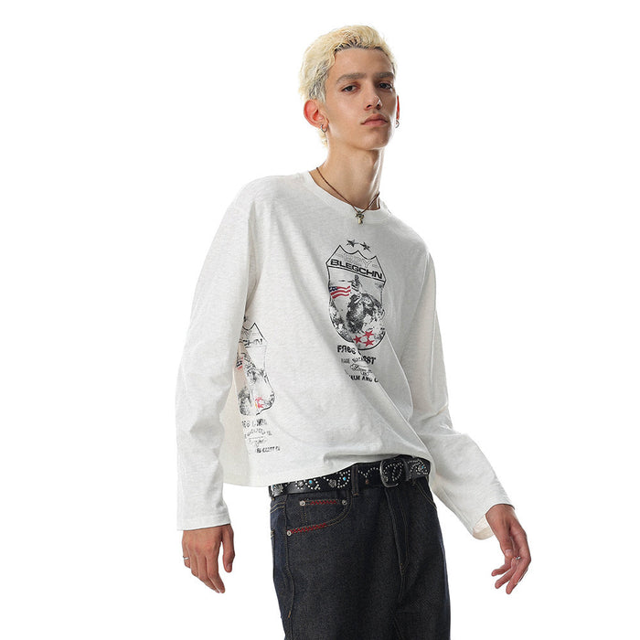 White long sleeve oversized tee with front graphic print, worn by model