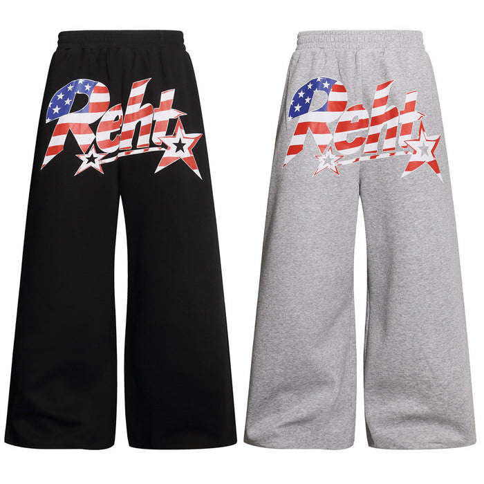 Front view of black and gray wide-leg sweatpants with red, white, and blue star graphic