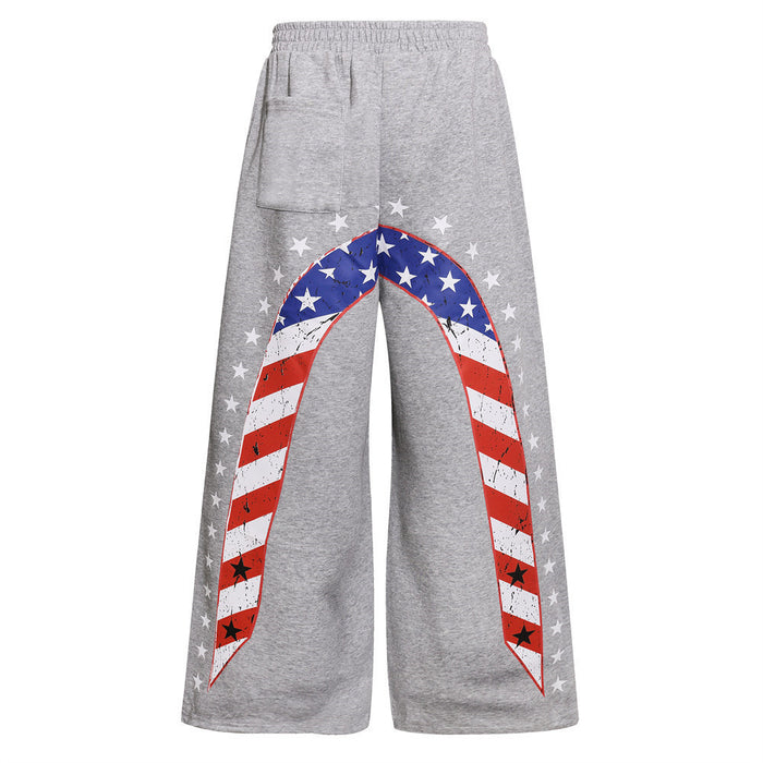 Back view of gray wide-leg sweatpants with arched American flag stripes and white stars