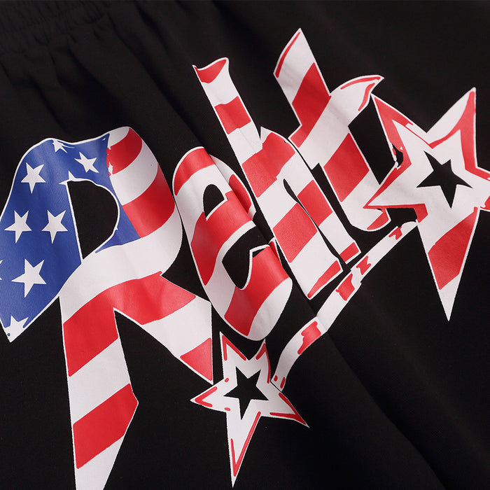 Detailed close-up of red, white, and blue striped lettering with star accents on black fabric