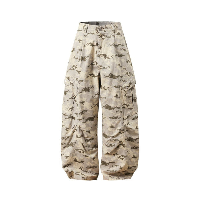 Front view of beige desert camo cargo pants with pleated wide legs