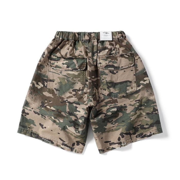 Camouflage cargo shorts with back pockets and elastic waistband, back view