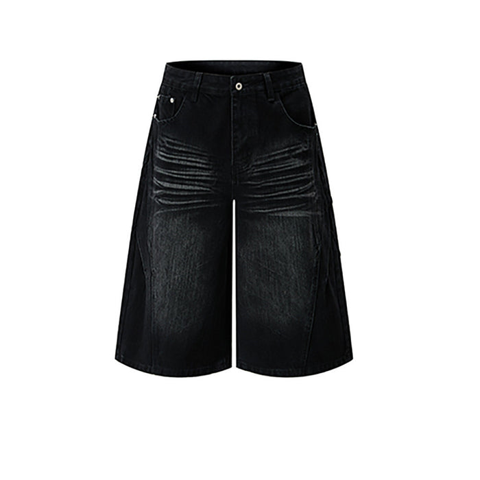 Men's baggy wide-leg distressed denim jean shorts in washed black with vintage crease detailing, front view