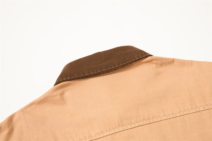 Close-up of the shirt back showing the dark brown contrast collar and upper back seam