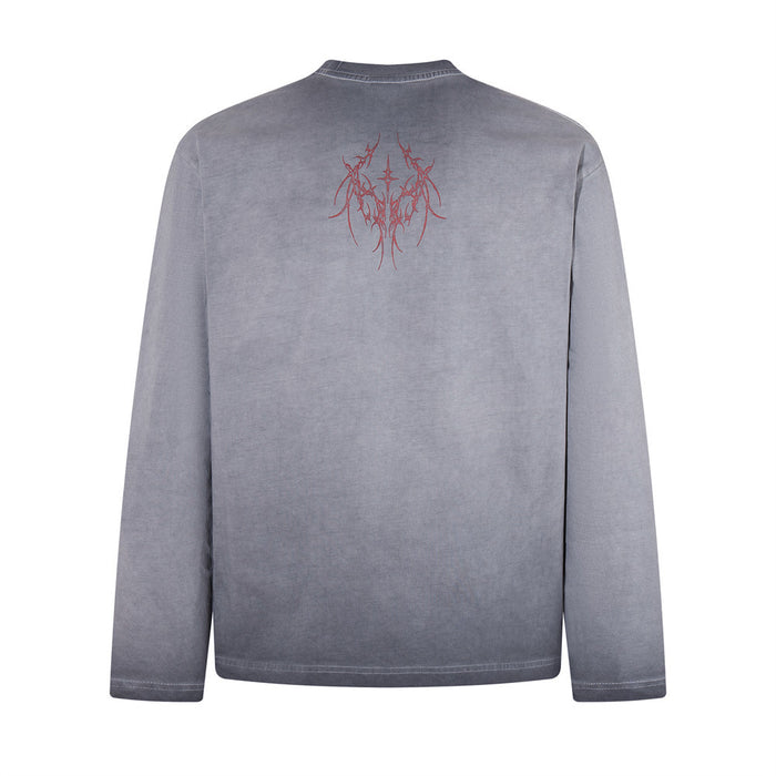 Gray long sleeve shirt shown from the back with a small red abstract graphic below the collar
