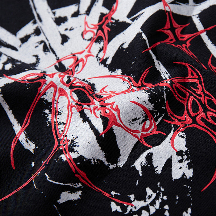 Detailed close-up of red abstract linework over a white and black skull graphic