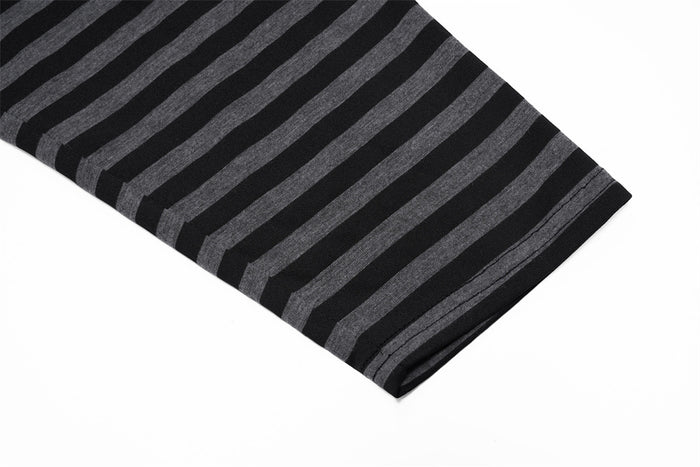 Close-up of a black and gray horizontally striped sleeve with a neatly finished cuff