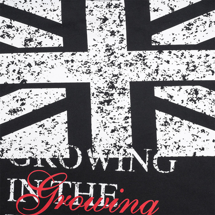 Close-up of the distressed Union Jack print and layered white and red lettering on the black shirt back
