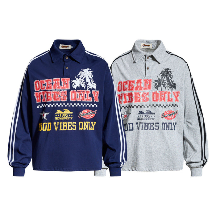 Two long sleeve rugby shirts, navy and heather gray, with ocean vibes graphic and striped sleeves