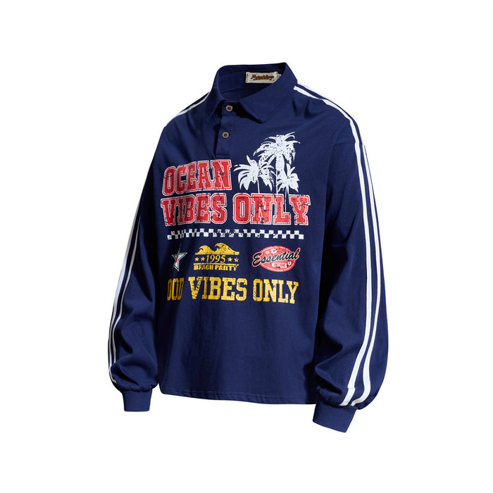 Navy long sleeve rugby shirt with Ocean Vibes Only graphic and white sleeve stripes, angled front view