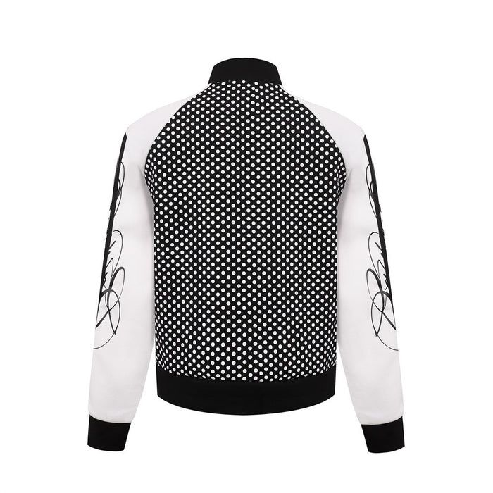 Back view of black polka dot track jacket with white sleeves, black ribbed collar, cuffs, and waistband