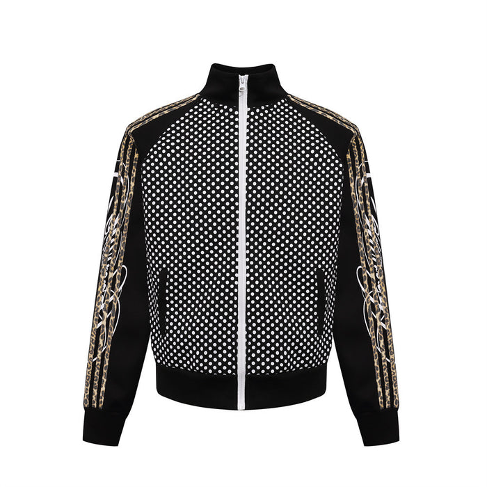 Front view of black polka dot track jacket with gold-patterned sleeve stripes, stand collar, and white zipper