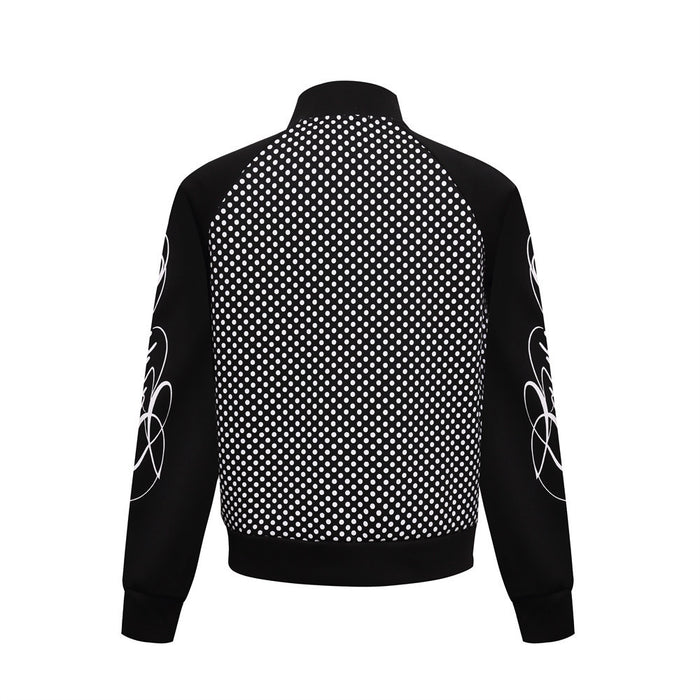 Back view of black polka dot track jacket with black sleeves and white looping graphics on the arms