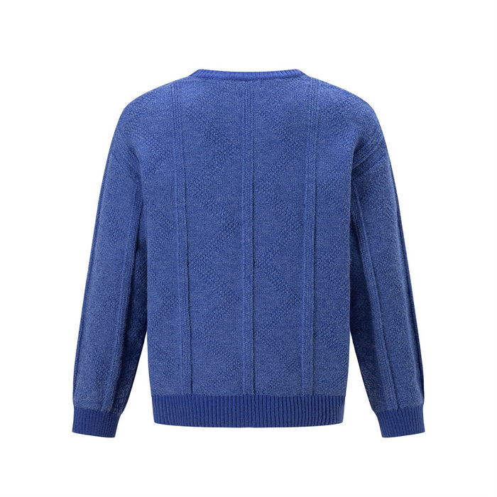 Back view of a blue crewneck sweater showing vertical knit panels, diamond texture, and ribbed hem