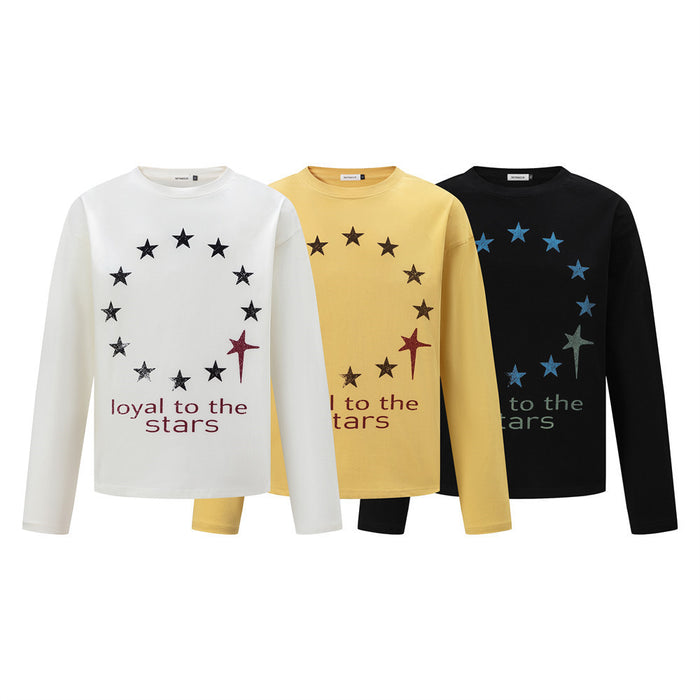 Three long-sleeve crew-neck shirts in white, yellow, and black with star circle graphics and text