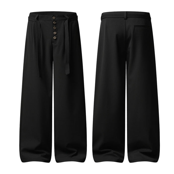 Black wide-leg pleated trousers shown front and back, with button fly, belt loops, and rear pocket