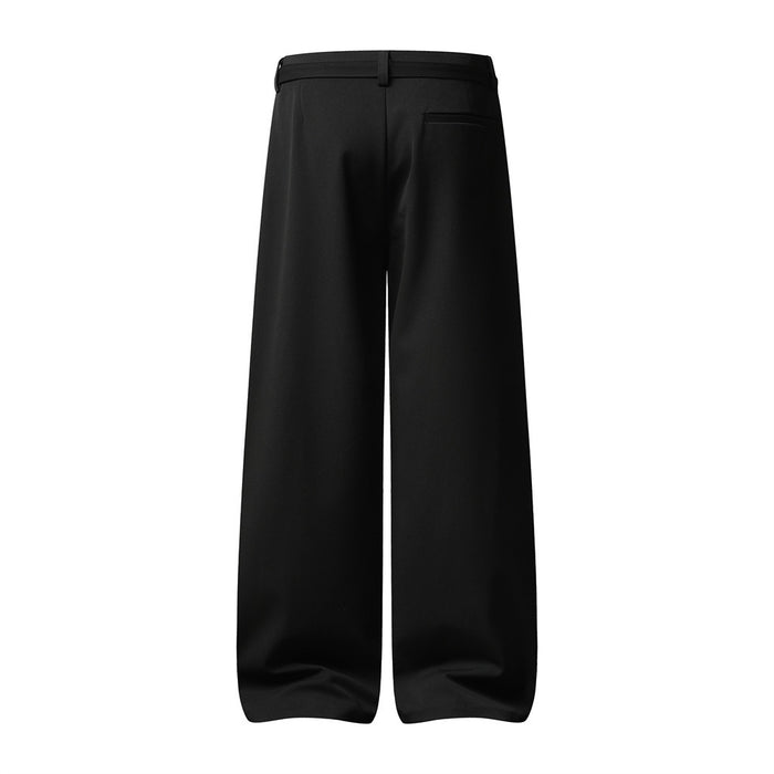 Back view of black wide-leg trousers showing the waistband, belt loops, rear welt pocket, and flowing legs