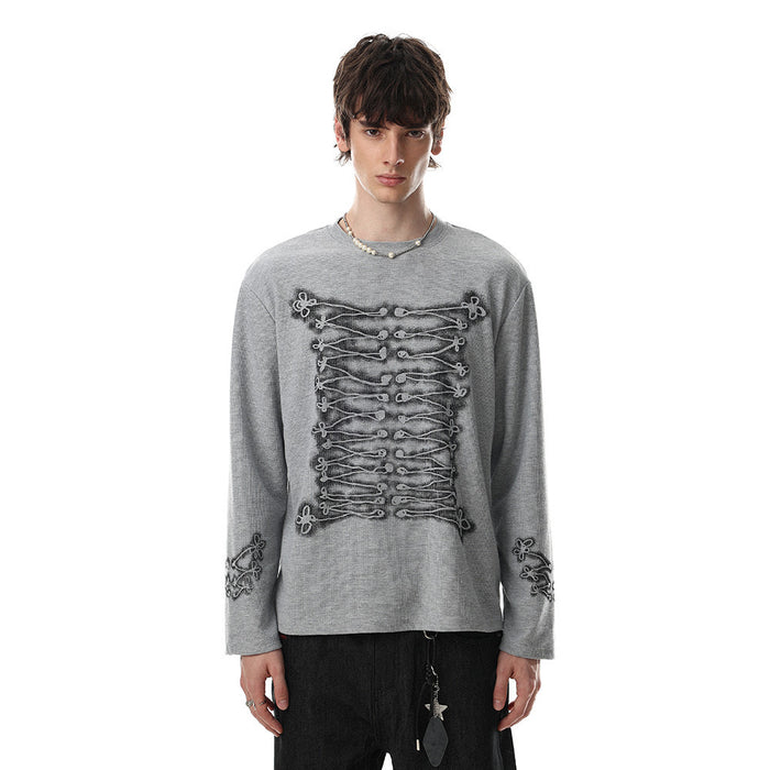 Gray oversized long sleeve crew neck tee worn by male model with rope-knot lace-up front graphic